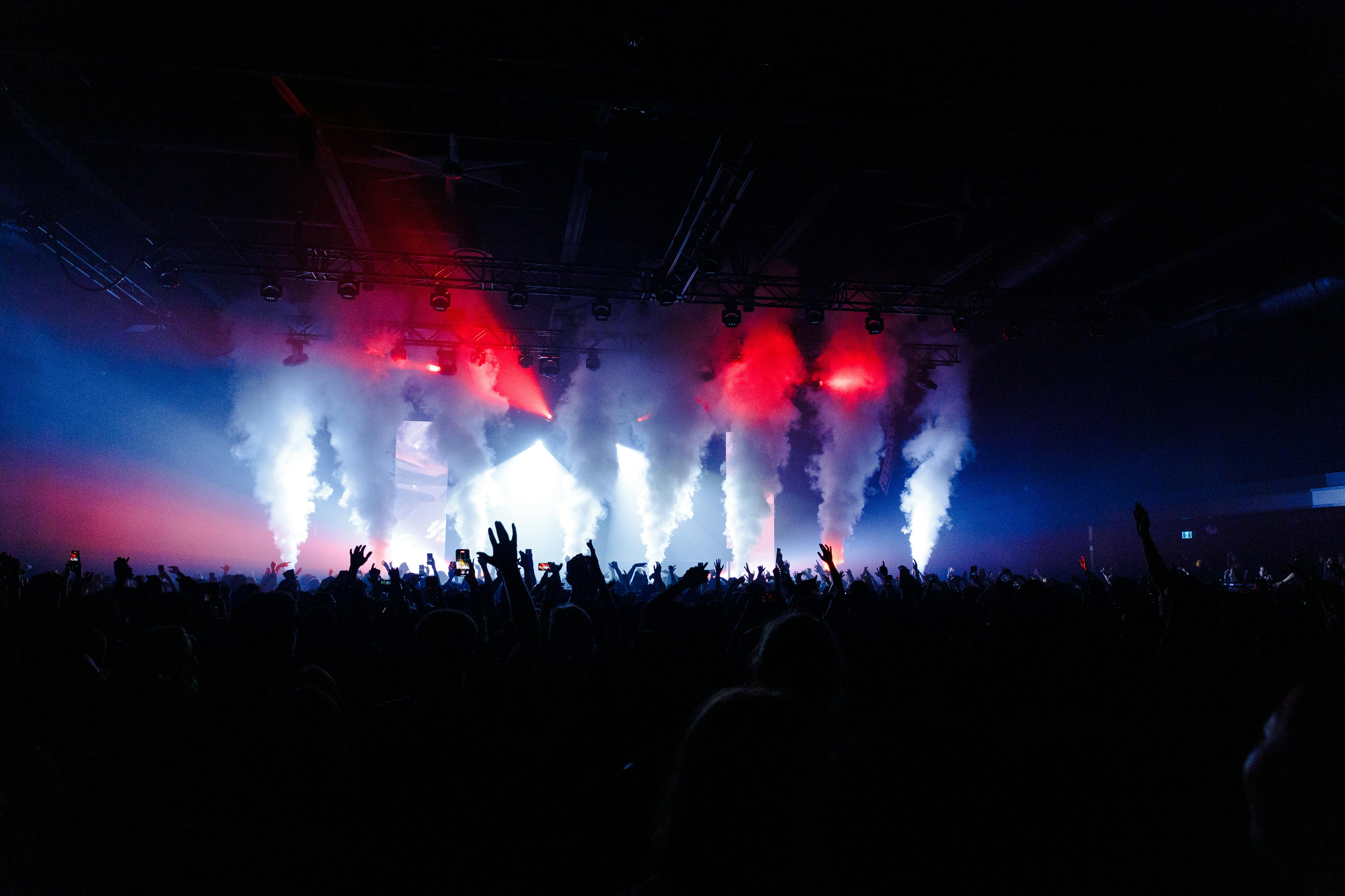 Crowd at a concert with stage lights